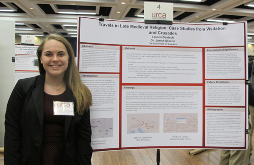 Lauren Deutsch in front of her research presentation.