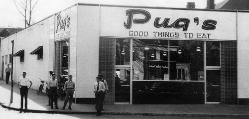 This image shows Pug's Restaurant, with several customers milling about. 
