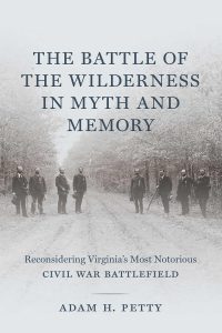 image of dust jacket for Petty's book. It shows veterans standing on a dirt road on the Wilderness battlefield