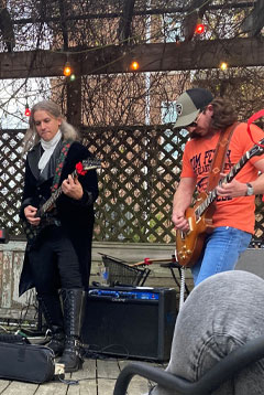 Dan Holtsberry, on left, plays lead guitar, while Trayce Brusco, on right, plays rhythm guitar.
