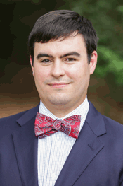 Photo of Matthew L. Downs in a blazer and bow tie.
