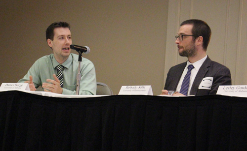 This is an image of Daniel Burge (left) and Roberto Saba (right) on the dais. 