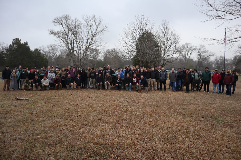 Panoramic view of everyone in front of the cannons at the visitor's center parking lot. 