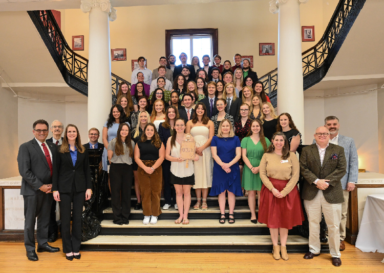 Phi Beta Kappa inductees standing on the staircase in Smith Hall