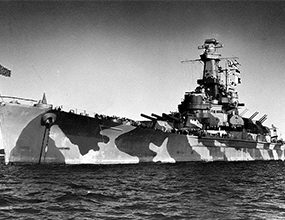 USS Alabama with tiger-stripe camouflage during World War II.